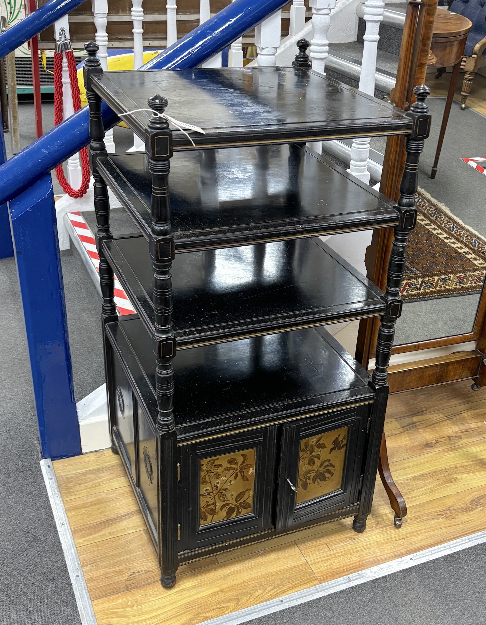 A Victorian Jas Shoolbred inlaid ebonised whatnot, width 50cm, depth 51cm, height 105cm